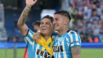 Racing's Colombian midfielder #08 Juan Fernando Quintero and Racing's defender #27 Gabriel Rojas celebrate after winning the Copa Sudamericana final football match between Argentina's Racing and Brazil's Cruzeiro at La Nueva Olla Stadium in Asuncion on November 23, 2024. (Photo by JUAN MABROMATA / AFP)