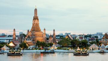 Wat Arun and cruise ship in night ,Bangkok city ,Thailand