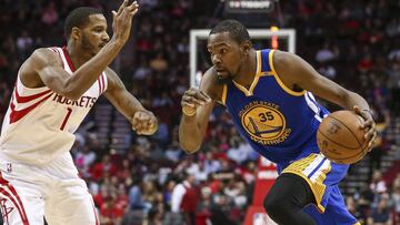 Jan 20, 2017; Houston, TX, USA; Golden State Warriors forward Kevin Durant (35) dribbles the ball as Houston Rockets forward Trevor Ariza (1) defends during the third quarter at Toyota Center. Mandatory Credit: Troy Taormina-USA TODAY Sports