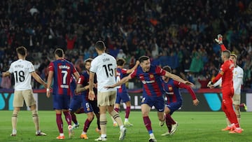 Barcelona's Polish forward #09 Robert Lewandowski celebrates after scoring his team's third goal during the Spanish league football match between FC Barcelona and Valencia CF at the Estadi Olimpic Lluis Companys in Barcelona on April 29, 2024. (Photo by LLUIS GENE / AFP)
