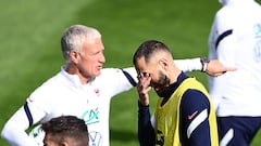 France's forward Karim Benzema (R) and France's coach Didier Deschamps attend a training session in Clairefontaine-en-Yvelines on May 27, 2021, as part of the team's preparation for the upcoming UEFA Euro 2020 football tournament. - France will play a friendly match against Wales on June 2 and against Bulgaria on June 8 as part of the team's Euro 2020 preparation. (Photo by FRANCK FIFE / AFP)