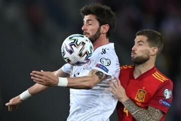 Georgia's forward Giorgi Kvilitaia and Spain's defender Inigo Martinez Berridi vie for the ball during the FIFA World Cup Qatar 2022 qualification football match Georgia v Spain in Tbilisi on March 28, 2021.