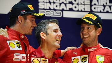 SINGAPORE, SINGAPORE - SEPTEMBER 22: Race winner Sebastian Vettel of Germany and Ferrari and second placed Charles Leclerc of Monaco and Ferrari celebrate on the podium during the F1 Grand Prix of Singapore at Marina Bay Street Circuit on September 22, 20
