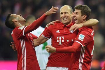 Thiago Alcantara and Arjen Robben celebrate Bayern Munich's fourth goal of the day and a first of the season for Thomas Mueller.