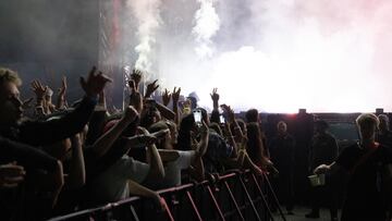 A crew member carries cups of water for the audience as Skrillex performs at Open'er Festival in Gdynia, Poland July 7, 2024. REUTERS/Peter Pawlowski