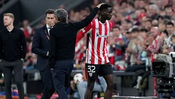 Athletic Bilbao's Spanish coach Ernesto Valverde greets Athletic Bilbao's Spanish defender #32 Adama Boiro as he leaves the pitch during the UEFA Europa League 1st round day 5 football match between Athletic Club Bilbao and IF Elfsborg at the San Mames stadium in Bilbao on November 28, 2024. (Photo by Cesar Manso / AFP)