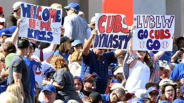 LAS VEGAS, NV - MARCH 26: Chicago Cubs fans hold up signs as they attend the team&#039;s exhibition game against the Cincinnati Reds at Cashman Field on March 26, 2017 in Las Vegas, Nevada. The Cubs won 22-4.   Ethan Miller/Getty Images/AFP
 == FOR NEWSPAPERS, INTERNET, TELCOS &amp; TELEVISION USE ONLY ==