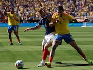 France's defender #03 Lucas Digne and Colombia's defender #02 Daniel Munoz fight for the ball during a friendly football match between Colombia and France at Northwest Stadium in Landover, Maryland, on March 29, 2026. (Photo by FRANCK FIFE / AFP)