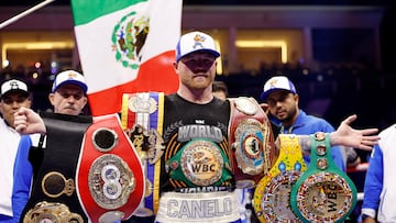 Boxing - Saul 'Canelo' Alvarez vs William Scull - Undisputed Super Middleweight Championship - ANB Arena, Riyadh, Saudi Arabia - May 3, 2025 Saul 'Canelo' Alvarez poses with his championship belts and celebrates after winning his super middleweight fight against William Scull REUTERS/Hamad I Mohammed
