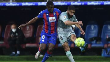EIBAR, SPAIN - MAY 13: Nabil Fekir of Real Betis is challenged by Papakouli Diop of Eibar during the La Liga Santander match between SD Eibar and Real Betis at Estadio Municipal de Ipurua on May 13, 2021 in Eibar, Spain. Sporting stadiums around Spain re