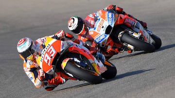 Repsol Honda's Spanish rider Marc Marquez (L) and Ducati Team's Spanish rider Jorge Lorenzo ride during the MotoGP first free practice of the Aragon Grand Prix at the Motorland racetrack in Alcaniz, on September 21, 2018 (Photo by JOSE JORDAN /