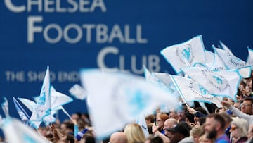 Fans wave banners ahead of the UEFA Women's Champions League semi-final first leg football match between Chelsea and Barcelona at Stamford Bridge, in London, on April 22, 2023. (Photo by Adrian DENNIS / AFP)