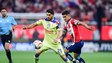    Henry Martin (L) of America fights for the ball with Victor Guzman (R) of America  during the Semifinals first leg match between Guadalajara and America as part of the Torneo Clausura 2024 Liga BBVA MX at Akron Stadium on May 15, 2024 in Guadalajara, Jalisco, Mexico.