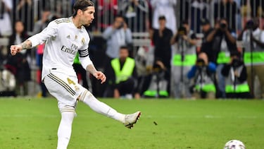Real Madrid's Spanish defender Sergio Ramos shoots to score the winning penalty during the Spanish Super Cup final between Real Madrid and Atletico Madrid on January 12, 2020, at the King Abdullah Sports City in the Saudi Arabian port city of Jeddah.