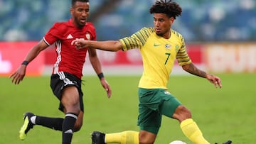 South Africa&#039;s midfielder Keagan Dolly (R) vies for the ball with Libya&#039;s forward Hamdou Elhouni (L) during the 2019 Africa Cup of Nations qualifier match between South Africa and Libya, on September 8, 2018 in Durban, South Africa. (Photo by AN