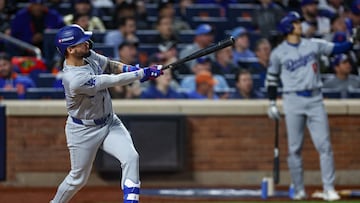 Oct 18, 2024; New York City, New York, USA; Los Angeles Dodgers shortstop Mookie Betts (50) hits a solo home run during the fourth inning against the New York Mets during game five of the NLCS for the 2024 MLB playoffs at Citi Field. Mandatory Credit: Vincent Carchietta-Imagn Images