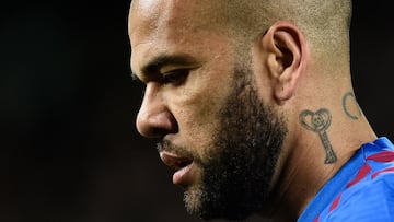 (FILES) In this file photo taken on March 13, 2022 Barcelona's Brazilian defender Dani Alves looks on during the Spanish league football match between FC Barcelona and CA Osasuna at the Camp Nou stadium in Barcelona. - Brazil defender Dani Alves was back in court on April 17, 2023 to testify before the judge investigating a rape allegation made by a woman in Barcelona for which he has been held in pre-trial detention. The 39-year-old, who has been remanded in custody since January 20, appeared in court at his own request, giving a 30-minute statement to the judge in which he reiterated his claim that the sex was consensual, judicial sources said. (Photo by Josep LAGO / AFP)