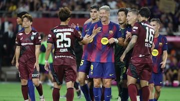 Barcelona's players including Robert Lewandowski (C) and Kobe's players shake hands after an international club friendly football match between Spain's FC Barcelona and Japan's Vissel Kobe at the Noevir Stadium Kobe in Kobe city, Hyogo prefecture on July 27, 2025. (Photo by JIJI PRESS / AFP) / Japan OUT