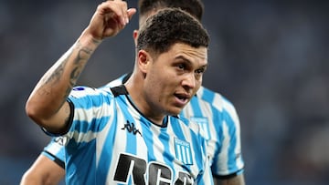 Racing's Colombian midfielder #08 Juan Fernando Quintero celebrates with teammate defender #27 Gabriel Rojas (unseen) after scoring during the Copa Sudamericana semi-final second leg football match between Argentina's Racing and Brazil's Corinthians at the Presidente Peron stadium in Avellaneda, Buenos Aires province, Argentina, on October 31, 2024. (Photo by ALEJANDRO PAGNI / AFP)