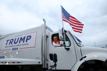 Republican presidential nominee Donald Trump sits inside garbage truck.