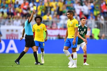 Soccer Football - World Cup - Round of 16 - Brazil vs Mexico - Samara Arena, Samara, Russia - July 2, 2018 Brazil's Casemiro is shown a yellow card by referee Gianluca Rocchi REUTERS/Dylan Martinez