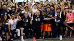 New England Patriots quarterback Tom Brady (C) poses for photos with participants at a football clinic for Japanese players in Tokyo, Japan June 21, 2017. REUTERS/Toru Hanai