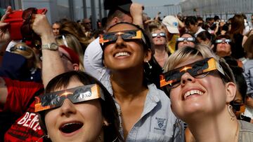 FILE PHOTO: People watch the solar eclipse from the observation deck of The Empire State Building in New York City, U.S., August 21, 2017.  Location coordinates for this image are 40?44'54" N 73?59'8" W.   REUTERS/Brendan McDermid/File Photo