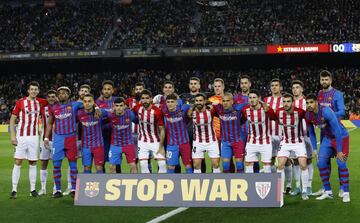 Soccer Football - LaLiga - FC Barcelona v Athletic Bilbao, Camp Nou, Barcelona, Spain, February 27, 2022 FC Barcelona and Athletic Bilbao players pose behind a banner in support of Ukraine before the match