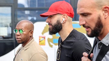 French footballer Karim Benzema (C) arrives at La Reunion's Roland-Garros airport in Sainte-Marie on November 29, 2022. - Ballon D'Or winner Karim Benzema has been ruled out of the World Cup with a left thigh injury on November 19, 2022 dealing a serious blow to defending champions France's hopes of retaining the trophy. (Photo by Richard BOUHET / AFP)