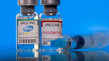 FILE PHOTO: Vials with Pfizer-BioNTech and Moderna coronavirus (COVID-19) vaccine labels are seen in this illustration picture taken March 19, 2021. REUTERS/Dado Ruvic/Illustration/File Photo