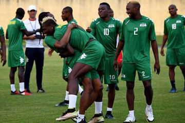 Burkina Faso's defender Bakary Kone and orward Aristide Bance joke during a training session in Libreville.