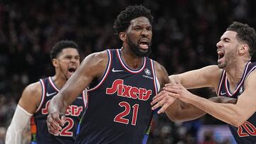 Apr 20, 2022; Toronto, Ontario, CAN; Philadelphia 76ers forward Georges Niang (20) congratulates center Joel Embiid (21) after he scored the game winning basket against the Toronto Raptors during overtime of game three of the first round for the 2022 NBA playoffs at Scotiabank Arena. Mandatory Credit: John E. Sokolowski-USA TODAY Sports