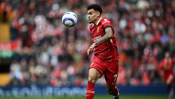 Liverpool's Colombian midfielder #07 Luis Diaz eyes the ball during the English Premier League football match between Liverpool and West Ham United at Anfield in Liverpool, north west England on April 13, 2025. (Photo by Paul ELLIS / AFP) / RESTRICTED TO EDITORIAL USE. No use with unauthorized audio, video, data, fixture lists, club/league logos or 'live' services. Online in-match use limited to 120 images. An additional 40 images may be used in extra time. No video emulation. Social media in-match use limited to 120 images. An additional 40 images may be used in extra time. No use in betting publications, games or single club/league/player publications. /