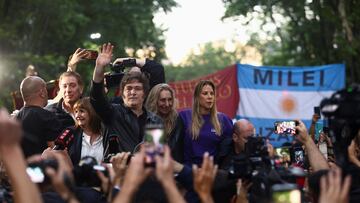 Argentina's President Javier Milei waves during a La Libertad Avanza party rally ahead of the October 26 midterm elections, seen as crucial for his administration after U.S. President Donald Trump warned that future support for Argentina would depend on Milei's party performing well in the vote, in Tres de Febrero, on the outskirts of Buenos Aires, Argentina, October 17, 2025. REUTERS/Matias Baglietto