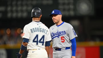 Sep 27, 2025; Seattle, Washington, USA; Seattle Mariners center fielder Julio Rodriguez (44) and Los Angeles Dodgers first baseman Freddie Freeman (5) talk during the fifth inning at T-Mobile Park. Mandatory Credit: Steven Bisig-Imagn Images