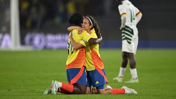 Colombia's forward Linda Caicedo (L) and Colombia's defender Jylis Corena celebrate after winning the 2024 FIFA U-20 Women's World Cup match between Colombia and Cameroon at El Campin stadium in Bogota on September 3, 2024. (Photo by Raul ARBOLEDA / AFP)