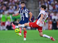 Oliver Torres (L) of Monterrey fights for the ball kith Mateo Chavez (L) of Guadalajara during the 14th round match between Monterrey and Guadalajara as part of the Liga BBVA MX, Torneo Clausura 2025 at BBVA Bancomer Stadium, on April 05, 2025 in Monterrey, Nuevo Leon, Mexico.