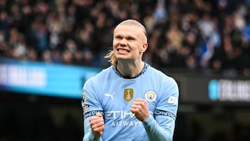 Manchester City's Norwegian striker #09 Erling Haaland celebrates after scoring his team first goal during the English Premier League football match between Manchester City and Brighton and Hove Albion at the Etihad Stadium in Manchester, north west England, on March 15, 2025. (Photo by Oli SCARFF / AFP) / RESTRICTED TO EDITORIAL USE. No use with unauthorized audio, video, data, fixture lists, club/league logos or 'live' services. Online in-match use limited to 120 images. An additional 40 images may be used in extra time. No video emulation. Social media in-match use limited to 120 images. An additional 40 images may be used in extra time. No use in betting publications, games or single club/league/player publications. /