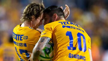 Tigres' Mexican midfielder Sebastian Cordova (L) celebrates with teammates French midfielder Andre-Pierre Gignac after scoring against Monterrey during the Mexican Clausura football tournament match between Tigres and Monterrey at Universitario stadium in Monterrey, Mexico, on May 17, 2023. (Photo by Julio Cesar AGUILAR / AFP)