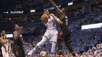 OKLAHOMA CITY, OK - APRIL 21: Russell Westbrook #0 of the Oklahoma City Thunder drives around James Harden #13 of the Houston Rockets for two points during the second half of Game Three in the 2017 NBA Playoffs Western Conference Quarterfinals on April 21