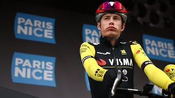 (FILES) Team Visma-Lease a Bike's Danish rider Jonas Vingegaard reacts prior to the start of the 5th stage of the Paris-Nice cycling race, 203,3 km between Saint-Just-en-Chevalet and La C�te-Saint-Andr�, on March 13, 2025. Two-time Tour de France winner Jonas Vingegaard withdrew from the Paris-Nice race before the start of the sixth stage on March 14, 2025, after injuring his hand in a fall. The Visma-Lease a Bike team said that its medical team had decided it was better that the Danish rider recovers at home and focus on upcoming goals. (Photo by Anne-Christine POUJOULAT / AFP)
