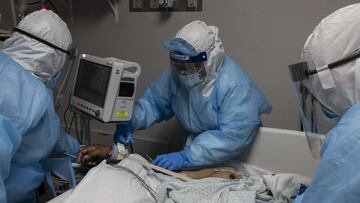 HOUSTON, TX - OCTOBER 31: Medical staff members treat a patient suffering from the coronavirus disease (COVID-19) in the COVID-19 intensive care unit (ICU) at the United Memorial Medical Center (UMMC) on October 31, 2020 in Houston, Texas. According to re