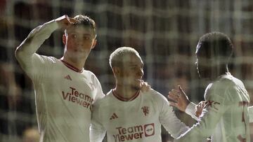 Soccer Football - FA Cup - Fourth Round - Newport County AFC v Manchester United - Rodney Parade, Newport, Wales, Britain - January 28, 2024 Manchester United's Antony celebrates scoring their third goal with Rasmus Hojlund and Kobbie Mainoo REUTERS/Carl Recine