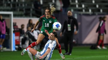 Feb 20, 2024; Carson, California, USA; Mexico forward Jasmine Casarez (18) passes the ball over Argentina defender Sophia Braun (13) during the second half of the 2024 Concacaf W Gold Cup group stage game at Dignity Health Sports Park. Mandatory Credit: Kiyoshi Mio-USA TODAY Sports