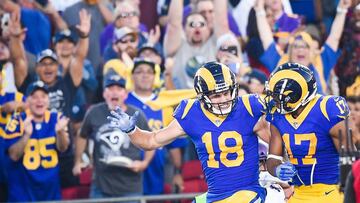 LOS ANGELES, CA - SEPTEMBER 27: Wide receiver Cooper Kupp #18 of the Los Angeles Rams celebrates his touchdown with wide receiver Robert Woods #17 at Los Angeles Memorial Coliseum on September 27, 2018 in Los Angeles, California.   Kevork Djansezian/Getty