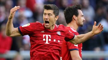 MUNICH, GERMANY - APRIL 06: Robert Lewandowski of Bayern Munich celebrates after scoring his team&#039;s second goal during the Bundesliga match between FC Bayern Muenchen and Borussia Dortmund at Allianz Arena on April 06, 2019 in Munich, Germany. (Photo