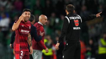 SEVILLE, SPAIN - NOVEMBER 06: Gonzalo Montiel of Sevilla FC reacts to being sent off during the LaLiga Santander match between Real Betis and Sevilla FC at Estadio Benito Villamarin on November 06, 2022 in Seville, Spain. (Photo by Angel Martinez/Getty Images)