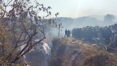 Crowds gather at the crash site of an aircraft carrying 72 people in Pokhara in western Nepal January 15, 2023. Sagar Raj Timilsina/Handout via REUTERS    THIS IMAGE HAS BEEN SUPPLIED BY A THIRD PARTY. MANDATORY CREDIT. NO RESALES. NO ARCHIVES.