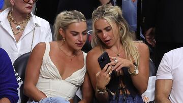 MIAMI, FLORIDA - JUNE 09: Haley and Hanna Cavinder are seen in attendance during Game Four of the 2023 NBA Finals NIL deals have allowed certain athletes to gain public attention through business agreements involving their name, image, and likeness.