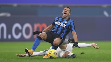 02 February 2021, Italy, Milan: Inter Milan&#039;s Alexis Sanchez is brought down by Juventus&#039; Merit Demiral during the Coppa Italia semi-final first leg soccer match between Inter Milan and Juventus at the Giuseppe Meazza stadium. Photo: Jonathan Mo